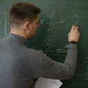 medium-shot-young-man-teaching-math.jpg