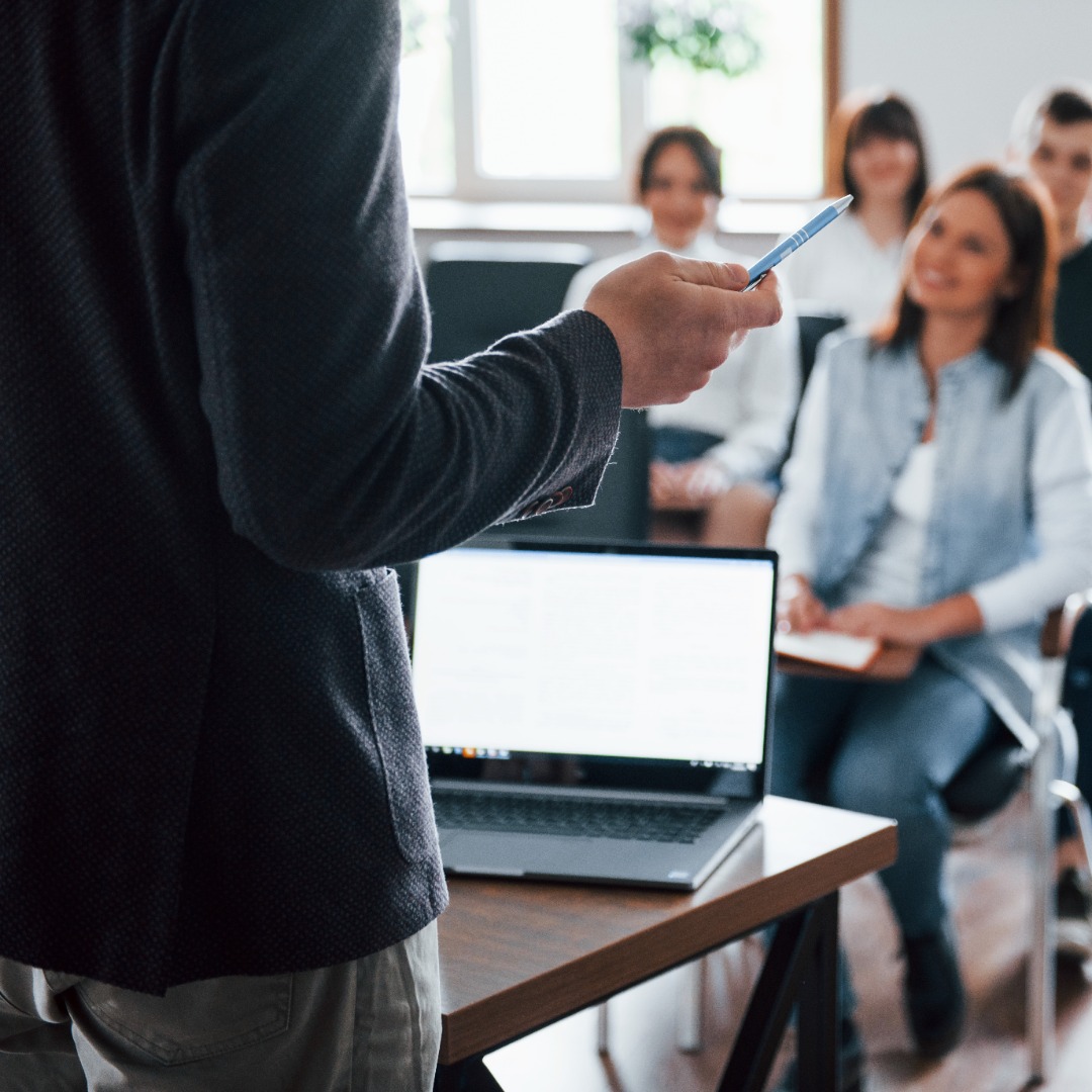 everyone-is-smiling-listens-group-people-business-conference-modern-classroom-daytime1.jpg