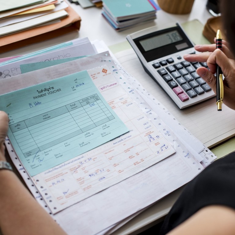 asian-woman-working-through-paperwork.jpg asian-woman-working-through-paperwork.jpg